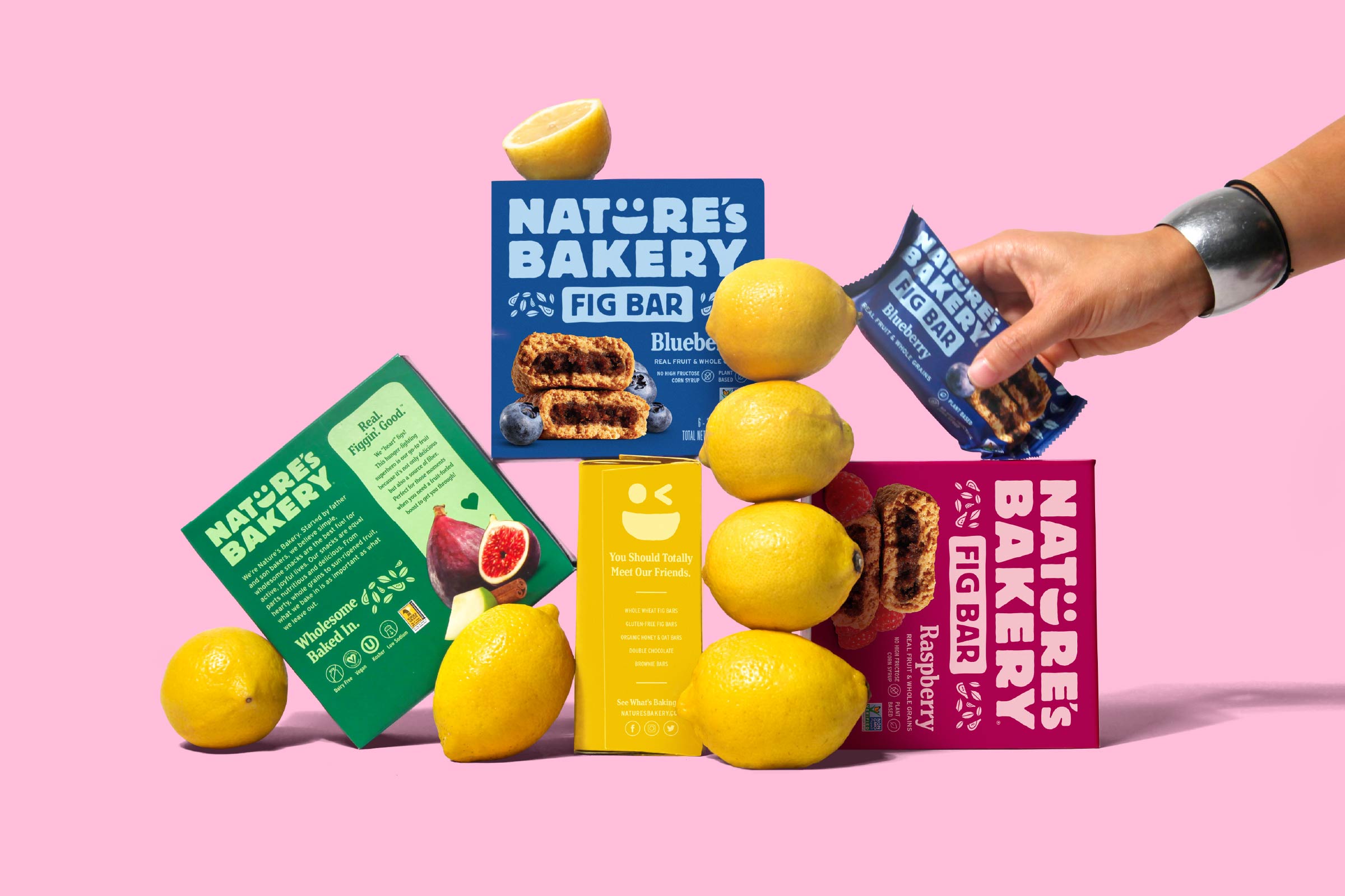 Nature's Bakery bar packaging design display with hand and lemons